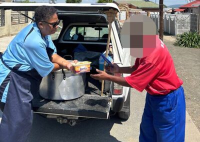 Regina Pacis, Ladysmith conference distributing a cooked meal to the needy