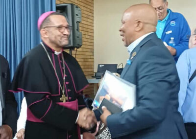 Archbishop Sithembele Sipuka greets Vincent Williams, National President of SSVP after Mass.